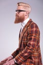 Side view of a young fashion man with long beard Royalty Free Stock Photo