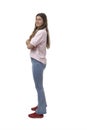 side view of a young girl standing smiling and looking at camera Royalty Free Stock Photo