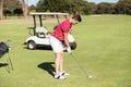 Side view of young man playing golf Royalty Free Stock Photo