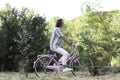 Side view of young man riding a bike through the nature breathing fresh air in spring Royalty Free Stock Photo