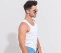 Side view of young man wearing undershirt and sunglasses Royalty Free Stock Photo