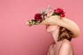 side view of young naked woman wearing hat with flowers Royalty Free Stock Photo