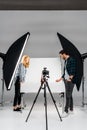 side view of young photographers working with professional equipment Royalty Free Stock Photo