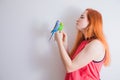 The beautiful woman admires her beautiful parrots Royalty Free Stock Photo