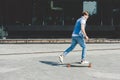 side view of young skateboarder riding longboard Royalty Free Stock Photo