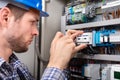 Technician Repairing Fuse Box With Screwdriver Royalty Free Stock Photo