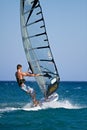 Side view of young windsurfer Royalty Free Stock Photo