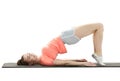 Side view of young woman doing gymnastics the half bridge pose Royalty Free Stock Photo