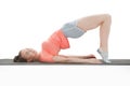 Side view of young woman doing gymnastics the half bridge pose Royalty Free Stock Photo
