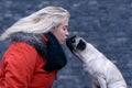 Side view of a Young woman with her pug Royalty Free Stock Photo