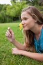 Side view of a young woman lying on the grass Royalty Free Stock Photo