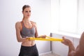 Young Woman With Gym Trainer Doing Exercise Royalty Free Stock Photo