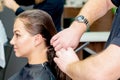 Woman is receiving haircut by hairdresser Royalty Free Stock Photo