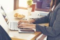 Side view of young working woman using laptop. Communication business concept Royalty Free Stock Photo