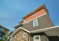 Side wall of brand new residential triplex townhouse on blue sky background