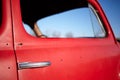 Side window of an old vintage red car Royalty Free Stock Photo