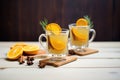 sidebyside hot toddies, one orange slice, one lemon Royalty Free Stock Photo