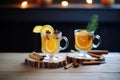 sidebyside hot toddies, one orange slice, one lemon Royalty Free Stock Photo