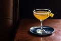 Sidecar Cocktail with Lemon Twist and Sugar in Bar Royalty Free Stock Photo