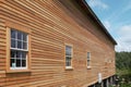 Side view of old barn with new siding and windows