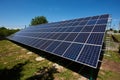 Sideview of huge solar panels installed on outdoors opened space.