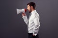 Sideview portrait of businessman with megaphone