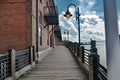 Sidewalk along the waterfront of the Cape Fear River overlooking Memorial Bridge Wilmington, NC Royalty Free Stock Photo