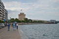 The sidewalk by the sea with the White Tower and the city in background