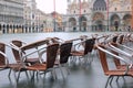 chairs submerged on Venice Square during the flood Royalty Free Stock Photo