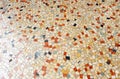 Sidewalk of a downtown street with grid mosaic pavement of small square marble pieces