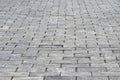 The sidewalk is made of rectangular gray granite bricks . Background Royalty Free Stock Photo