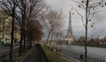 Sidewalk next to the Sena river with view of the Eiffel tower in Paris Royalty Free Stock Photo
