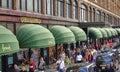 Crowd of Shoppers outside Harrods Luxury Department store in London