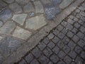 Sidewalk paved with tiles and natural stone in Greece