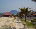 Sidewalk at Peruibe beach with palms trees Royalty Free Stock Photo