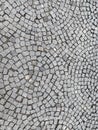 Sidewalk, radially paved with small square granite stones. radial pattern. Royalty Free Stock Photo