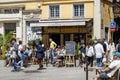 The sidewalk restaurant with visitors