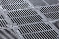 Sidewalk sewer grate with shallow depth of field Royalty Free Stock Photo