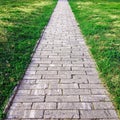 Sidewalk. Straight path of granite gray cobblestone