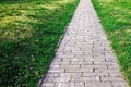 Sidewalk. Straight path of granite gray cobblestone