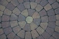 Sidewalk tiles laid out from the center. The circular walls