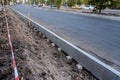 Sidewalk under construction, concrete curb installation. Ukraine Royalty Free Stock Photo