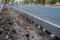 Sidewalk under construction, concrete curb installation. Ukraine Royalty Free Stock Photo
