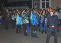 SIDMOUTH, DEVON, ENGLAND - AUGUST 10TH 2012: A group of Morris dancers dressed in decorated top hats and ragged blue waistcoats