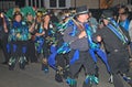 SIDMOUTH, DEVON, ENGLAND - AUGUST 10TH 2012: A group of Morris dancers dressed in decorated top hats and ragged blue waistcoats