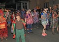 SIDMOUTH, DEVON, ENGLAND - AUGUST 10TH 2012: A group of Morris dancers dressed in flowered hats and ragged waistcoats take part in