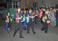 SIDMOUTH, DEVON, ENGLAND - AUGUST 10TH 2012: A group of musicians dressed in decorated top hats and ragged blue waistcoats take