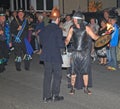 SIDMOUTH, DEVON, ENGLAND - AUGUST 10TH 2012: A man dressed as a fireman and another dressed as an ancient warrior take part in the