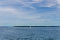 SIDNEY, CANADA - JULY 14, 2019: boat in haro strait view from Vancouver island with cloudy sky British Columbia Canada