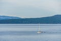 SIDNEY, CANADA - JULY 14, 2019: boat in haro strait view from Vancouver island with cloudy sky British Columbia Canada